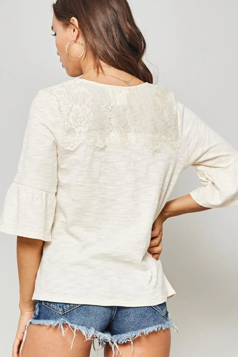 A Knit Top With Deep V Neckline And Yoke Design