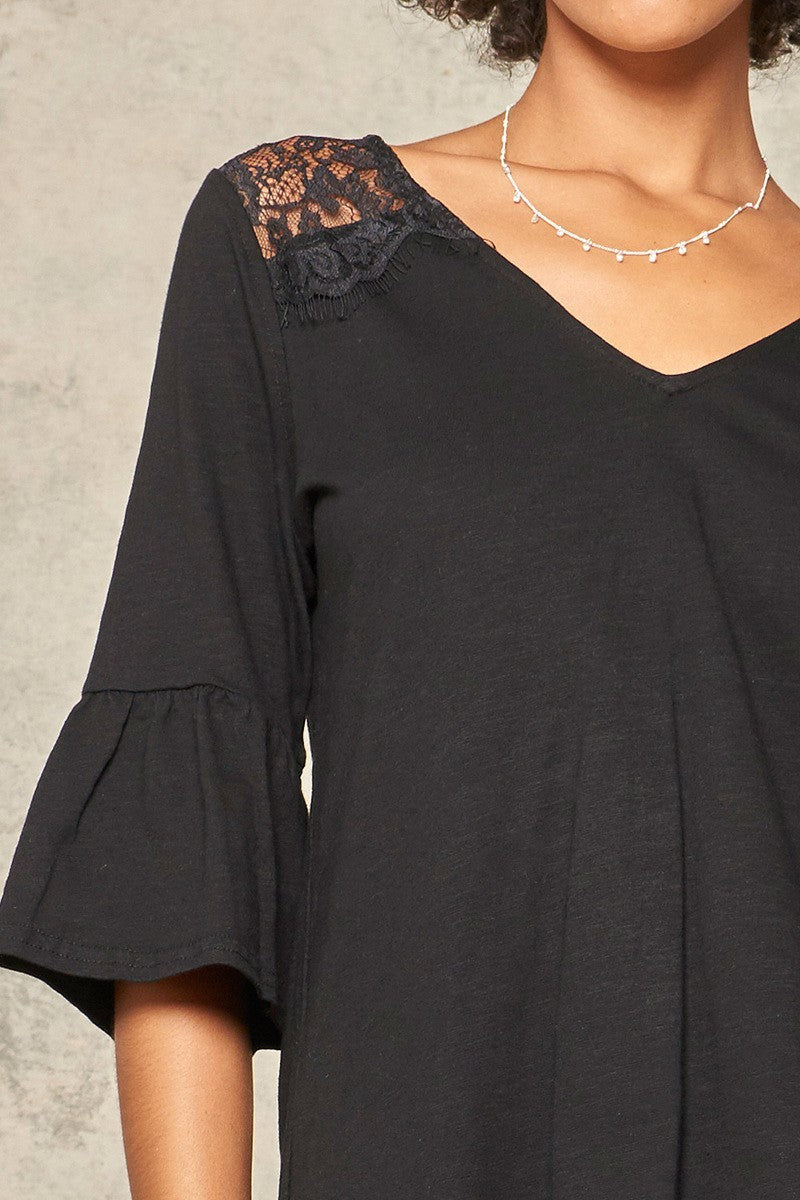 A Knit Top With Deep V Neckline And Yoke Design