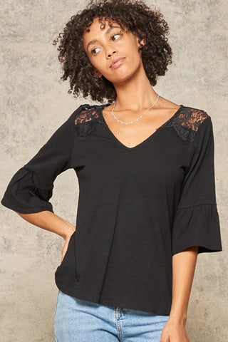 A Knit Top With Deep V Neckline And Yoke Design